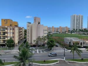 a view of a street in a city with buildings at Apartamento Decorado in Guarujá