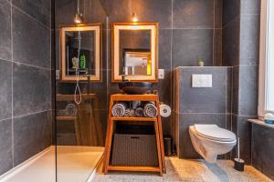 a bathroom with a sink and a toilet at Luxury Suites Boutique in Antwerp