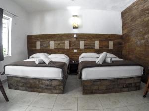 Postel nebo postele na pokoji v ubytování La Casa de las Lunas