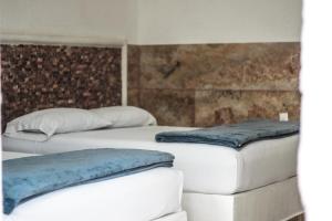 Postel nebo postele na pokoji v ubytování La Casa de las Lunas