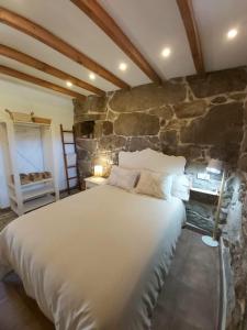Säng eller sängar i ett rum på Casa Rural A Gorgoriña