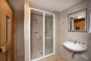 a bathroom with a shower and a sink at Chalet Edelweiss in Zell am See