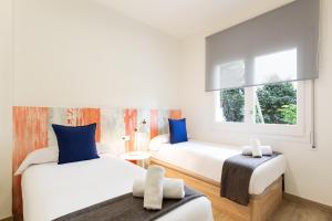 Posteľ alebo postele v izbe v ubytovaní Sitges Group Beach Dreams