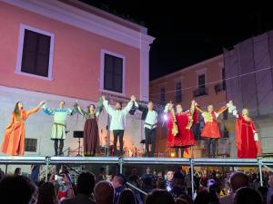 a group of people on a stage in front of a crowd at Bed & Breakfast De Nittis - Meridia Collection in Barletta