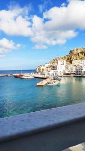 a view of a harbor with boats in the water at Mimis & Connie 1 in Karpathos Town