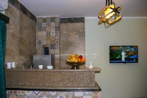 a kitchen with a bowl of fruit on a counter at Geo Palace in Dahab +28 photos