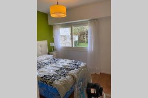 Katil atau katil-katil dalam bilik di Casa Jilguero para 8 personas Pinamar