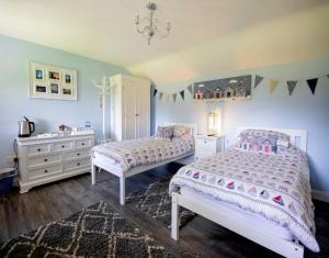 Katil atau katil-katil dalam bilik di Lawson Cottage B&B