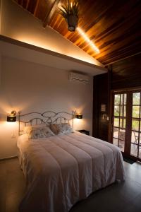 a bedroom with a large bed in a room at Pousada Vila Nakau in Fernando de Noronha