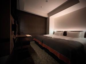 Postel nebo postele na pokoji v ubytování Nest Hotel Tokyo Hanzomon