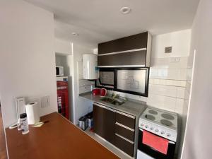 a kitchen with a stove and a counter top at Vittorio 55 in La Plata