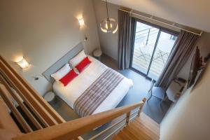 Postel nebo postele na pokoji v ubytování LOGIS Hôtel-restaurant IMAGO