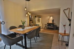 a dining room with a table and chairs at Bellevue in Malente