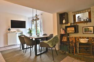 a dining room with a table and chairs at Bellevue in Malente