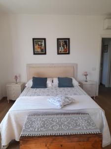 En eller flere senger på et rom på Villa la provenzale