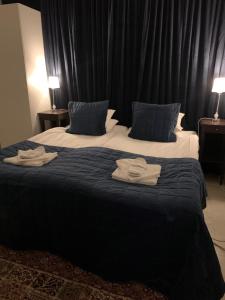 Postel nebo postele na pokoji v ubytování Hotell Kaprifol