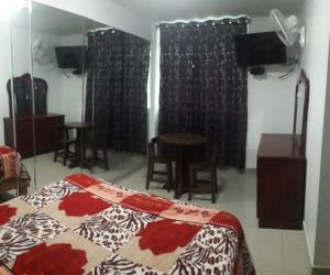 Ένα ή περισσότερα κρεβάτια σε δωμάτιο στο Hostal Sueños