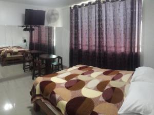 Ένα ή περισσότερα κρεβάτια σε δωμάτιο στο Hostal Sueños
