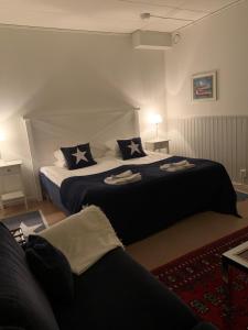Postel nebo postele na pokoji v ubytování Hotell Kaprifol