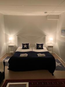 Postel nebo postele na pokoji v ubytování Hotell Kaprifol