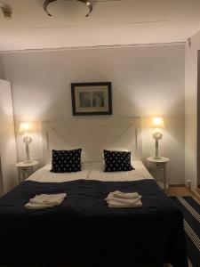 Postel nebo postele na pokoji v ubytování Hotell Kaprifol