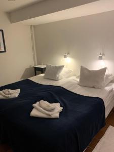 Postel nebo postele na pokoji v ubytování Hotell Kaprifol