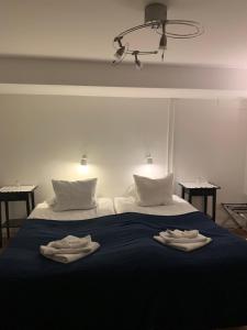 Postel nebo postele na pokoji v ubytování Hotell Kaprifol