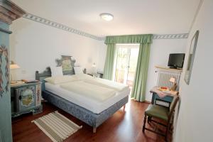 Posteľ alebo postele v izbe v ubytovaní Hotel Sonnenhof - bed & breakfast & appartements + 37 fotografií