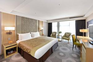 Postel nebo postele na pokoji v ubytování Fullon Hotel Kaohsiung