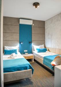 Postel nebo postele na pokoji v ubytování Garni hotel King