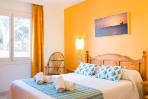 Postel nebo postele na pokoji v ubytování Sagitario Vista Playa II Apartamentos