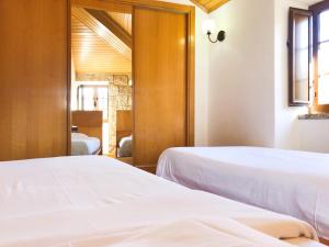מיטה או מיטות בחדר ב-Casa da Laje - Entre a Estrela e a Gardunha