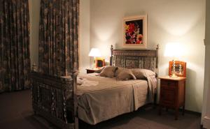 Postel nebo postele na pokoji v ubytování Hotel El Mirador