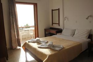 A bed or beds in a room at Studios Stavris