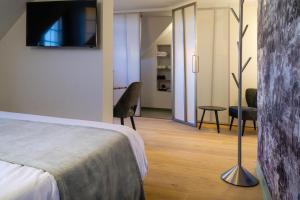 Uma cama ou camas num quarto em B&B Contrast