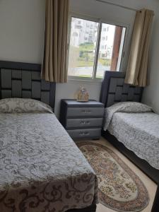 Llit o llits en una habitació de Appartement avec vue panoramique