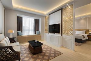 TV a/nebo společenská místnost v ubytování Sutasoma Hotel