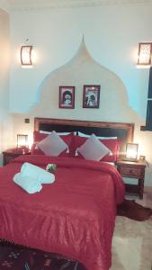 En eller flere senge i et værelse på Riad Simon