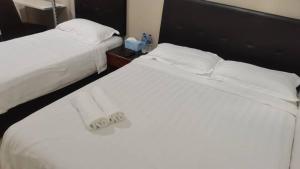 Postel nebo postele na pokoji v ubytování LSN Hotel (KL) Sdn Bhd