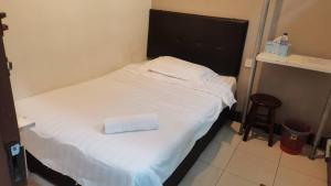 Postel nebo postele na pokoji v ubytování LSN Hotel (KL) Sdn Bhd