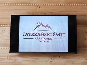 Apartament Tatrzański Świt z tarasem i garażem podziemnym, Grotą Solnąに飾ってある許可証、賞状、看板またはその他の書類