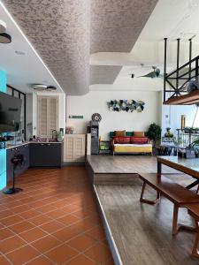 a living room with a couch and a table at Teacher Cai Homeestay in Xiaoliuqiu