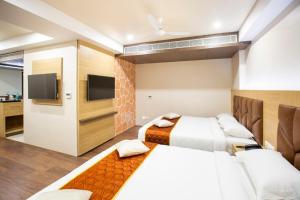 TV a/nebo společenská místnost v ubytování Lee-Benz ARK HOTEL