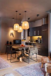 a kitchen and dining room with a table and chairs at Borovets Chalets in Borovets