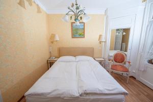 
Ein Bett oder Betten in einem Zimmer der Unterkunft Hotel La Prairie, Swiss Bike Hotel

