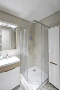 a bathroom with a shower and a sink at Duki New Belgrade in Belgrade