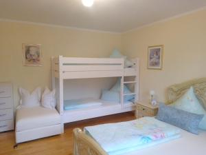 a bedroom with two bunk beds and a bed at Im Haus am Ries in Ehingen am Ries