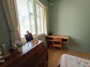 Postel nebo postele na pokoji v ubytování 博愛泊旅讀心境