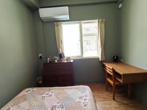 Postel nebo postele na pokoji v ubytování 博愛泊旅讀心境