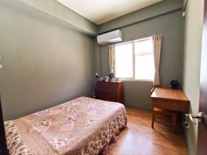 Postel nebo postele na pokoji v ubytování 博愛泊旅讀心境